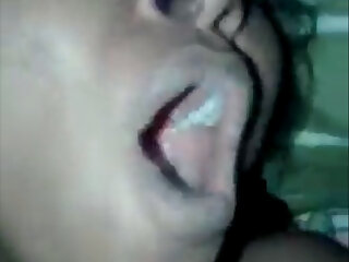 Pain and pleasure intertwined as a desi woman moans during sexual intercourse.